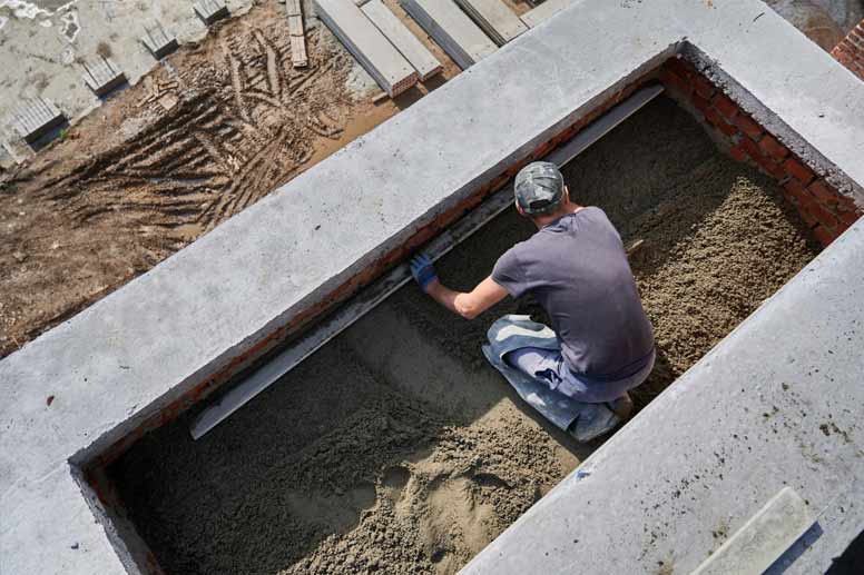 Concrete Worker Salary Guide: Concrete Worker Screeding Floor Construction Site