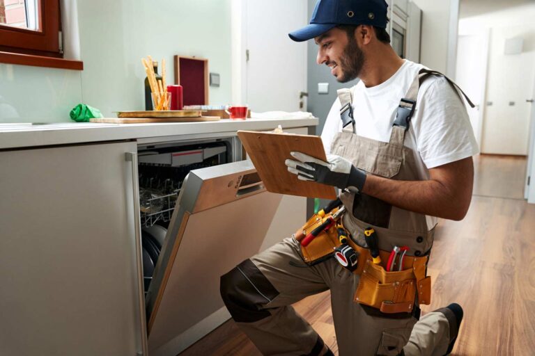 How Much Does Appliance Repair Cost: man fixing a dishwasher