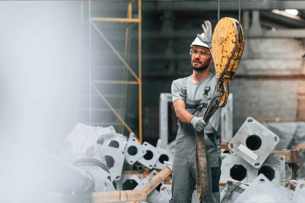 How To Get Your Concrete License In The US? Concrete Worker Next To A Crane