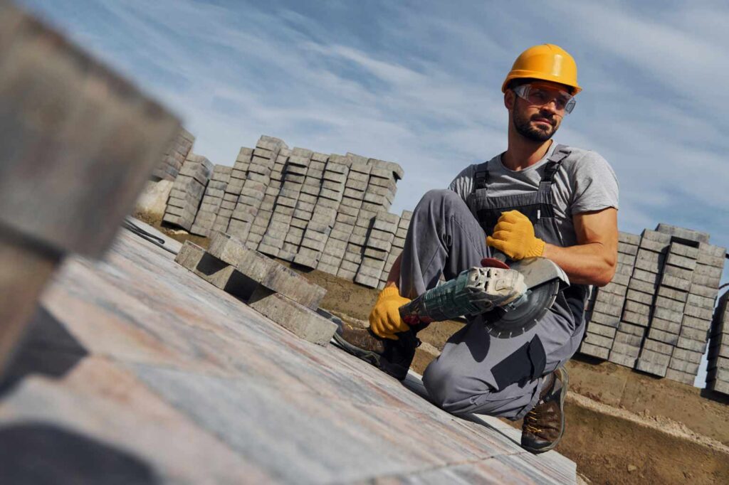 How To Get Your Roofing Insurance: Roofing Worker Using A Circular Saw