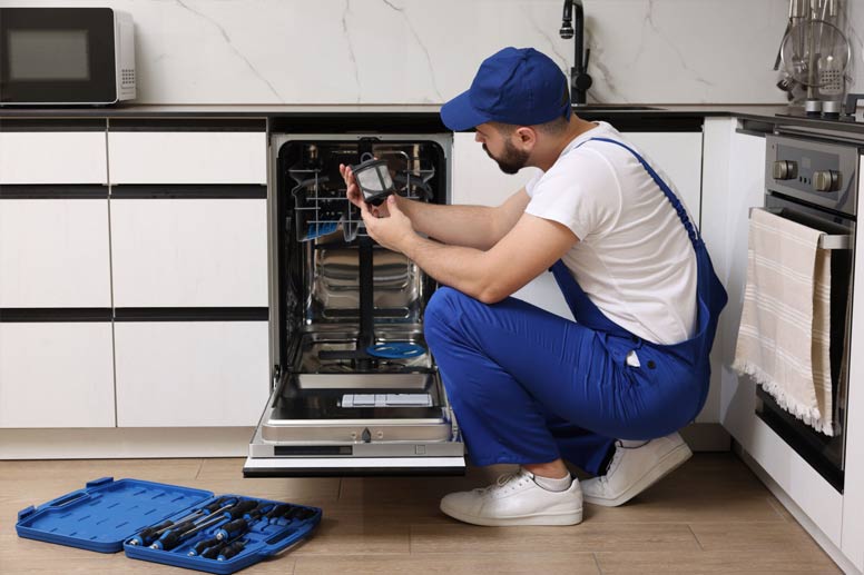 How To Get An Appliance Repair Business Insurance: Man Repairing Dishwasher