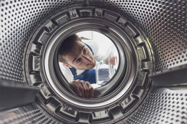 How To Get An Appliance Repair Business Insurance: Man Repairing Washing Machine