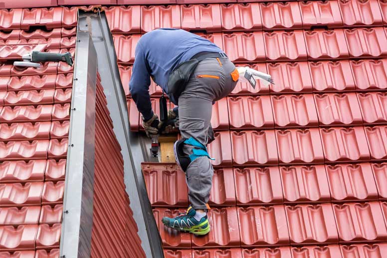 Roofer Salary Guide 2024 - Roofer Worker Rearing Roof