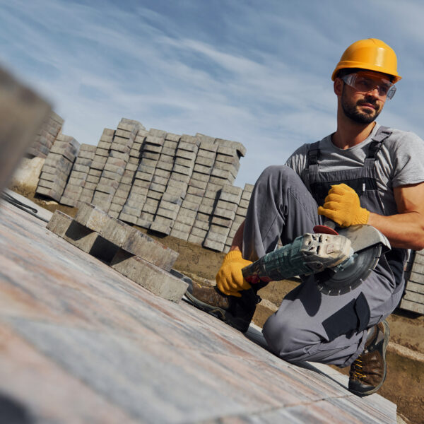 How To Get Your Roofing Insurance: Roofing Worker Using A Circular Saw