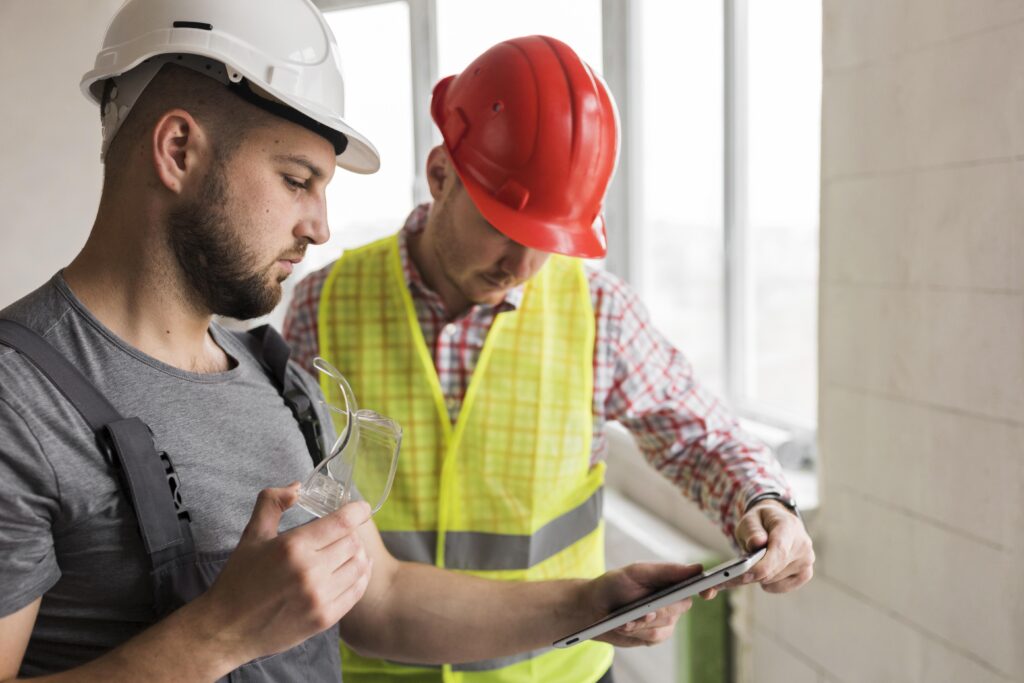 Construction business marketing manager showing CEO the next marketing strategy to get new leads.