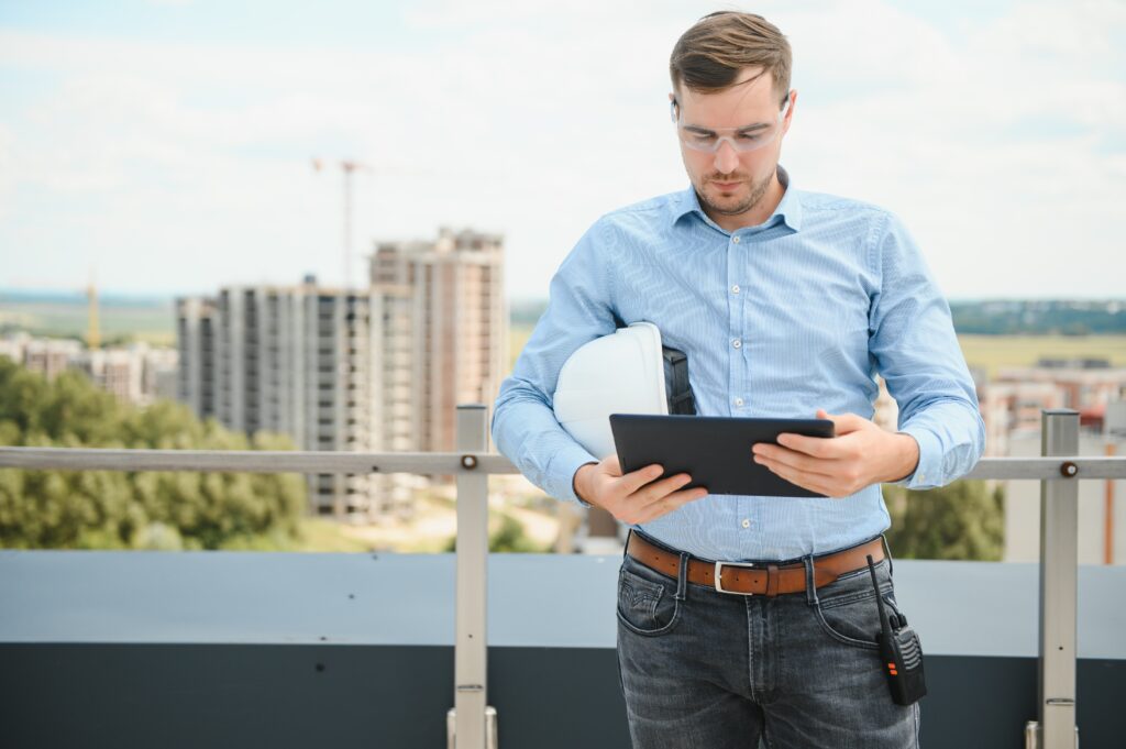 Head of Marketing standing in building in construction process.