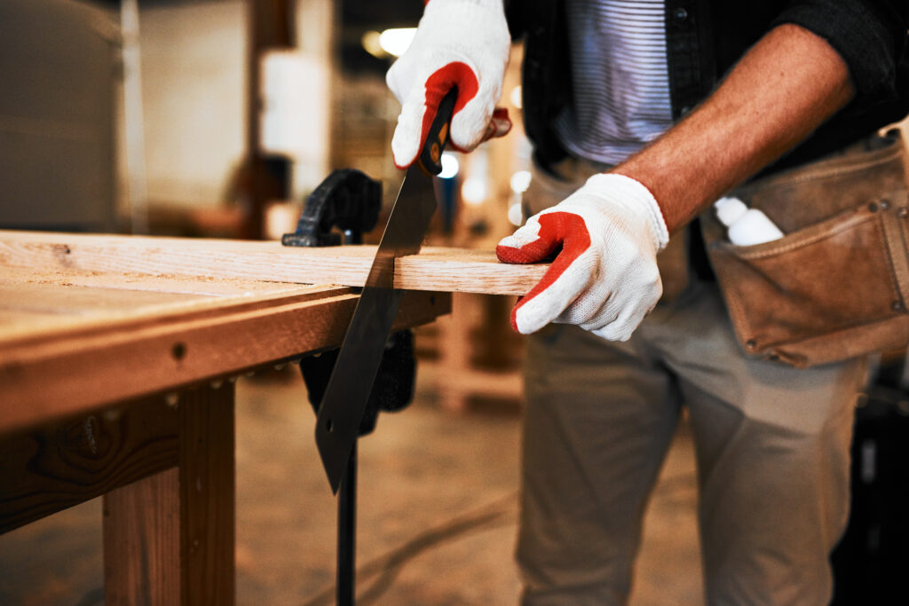 carpenter making sure he cuts in a straight line