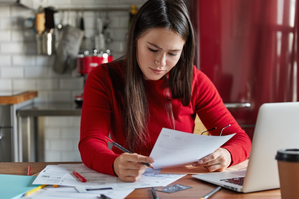 Small business owner reviewing SE tax form