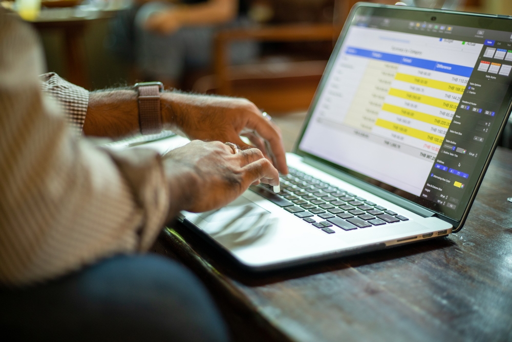 Small business owner sending automated invoice reminders.