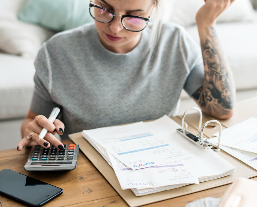 woman at desktop calculating VAT