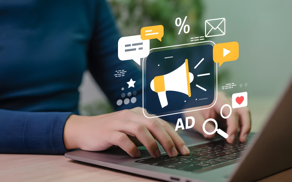 Digital marketing icons on a screen representing online advertising strategies for HVAC contractors.