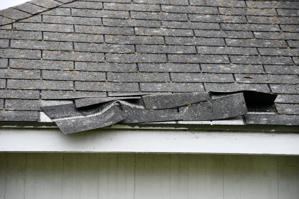 Close-up of roof wind damage.