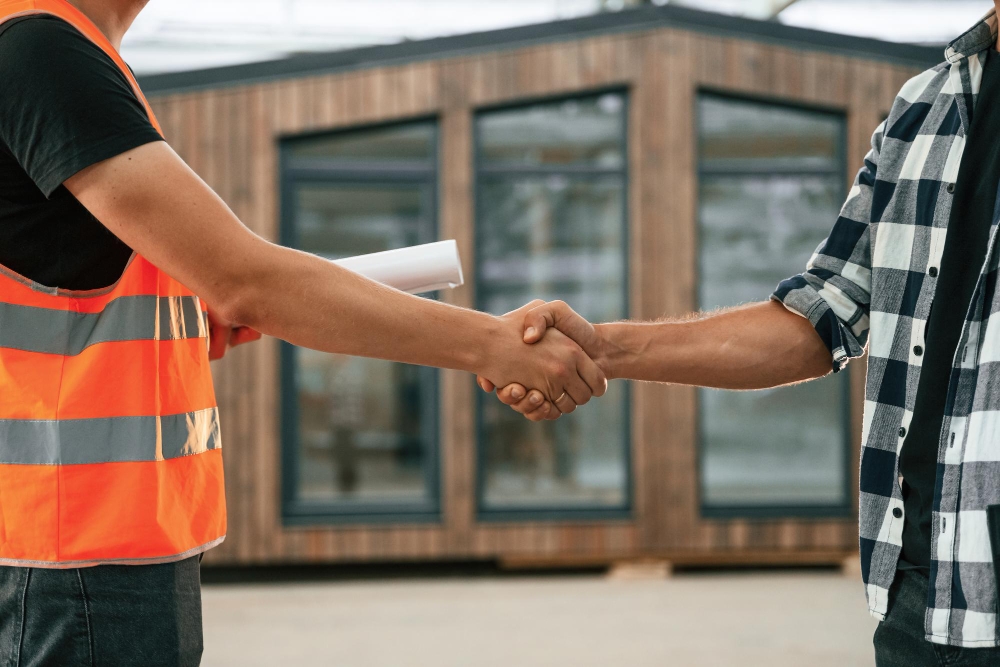 Roofing business owner closing a lead.