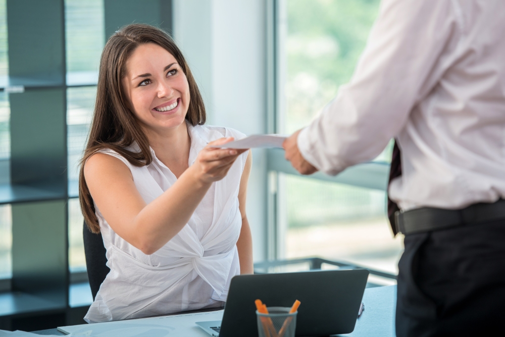 Small business owner negotiating with bank agent to get a business loan.
