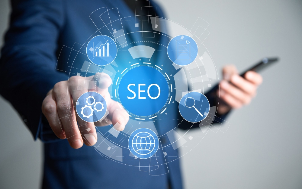 Business professional holding phone with SEO icon overlay


