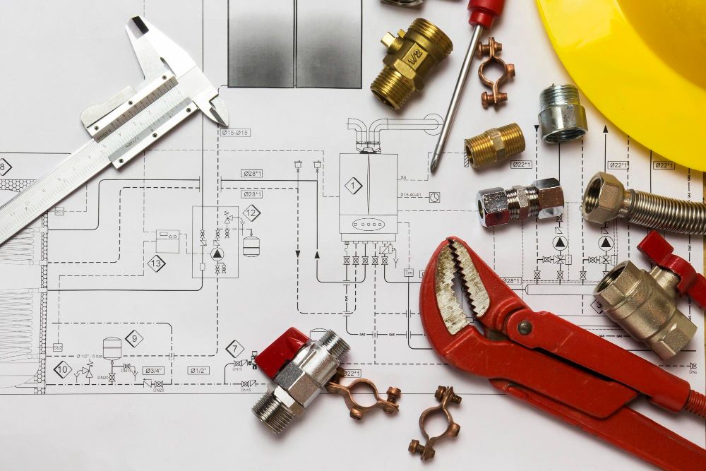 plumbing plan with tools on bench