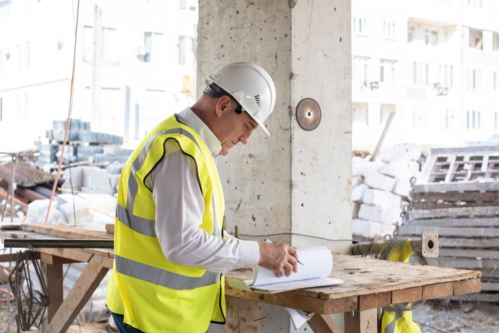 Trade specialist reviewing plans on a construction site