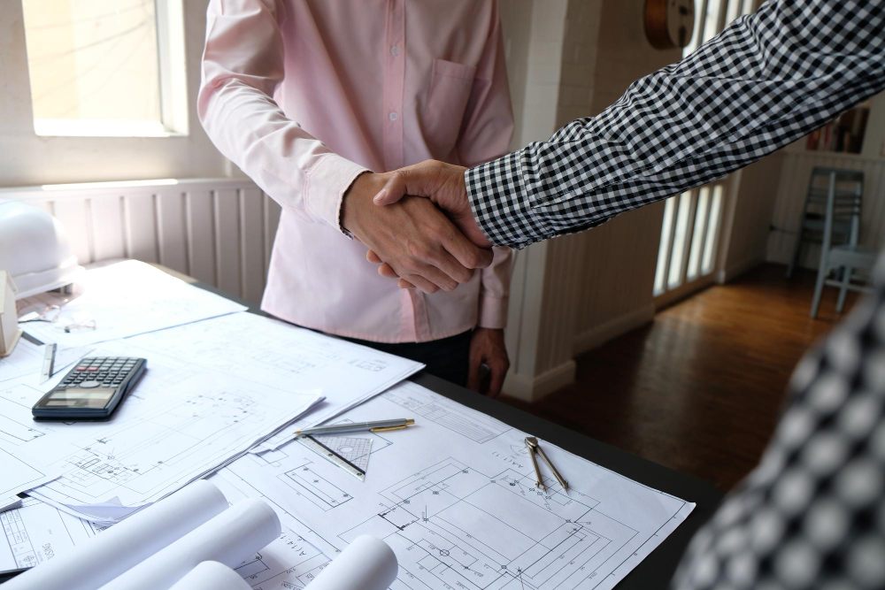 Contractor and trade partner signing a subcontractor agreement