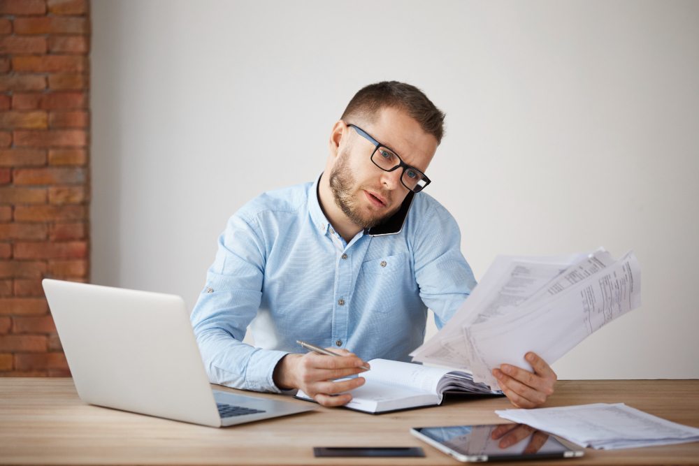 Accountant reviewing accumulated depreciation schedules