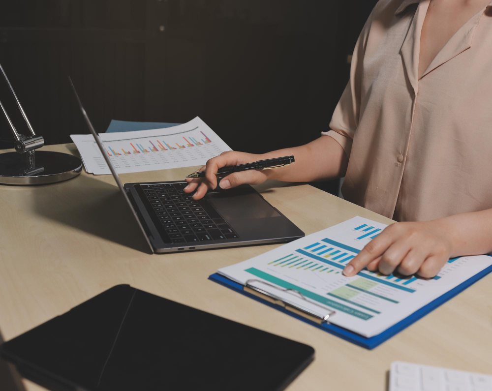 Reviewing expenses and accounts payable with calculator