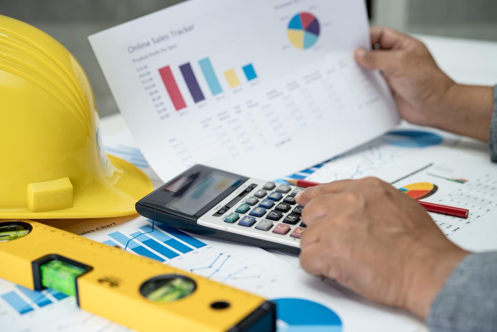 Person calculating production costs in Excel
