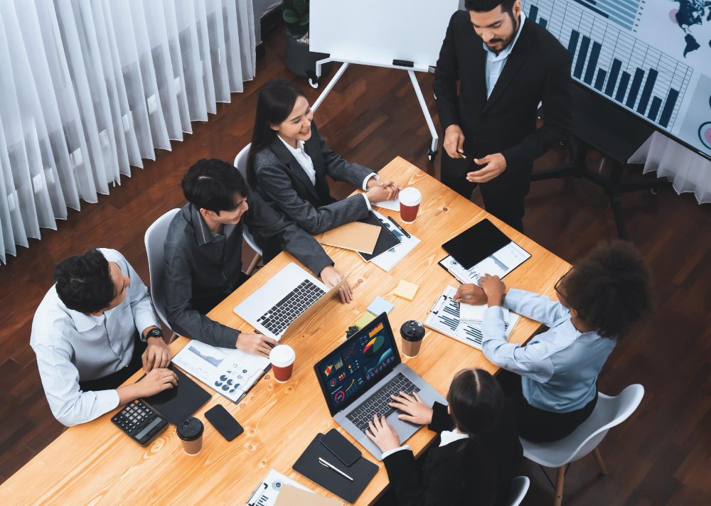 Team reviewing data and strategy dashboard for financial decision-making