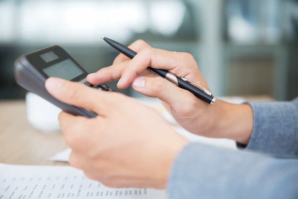 Person calculating deferred (prepaid) expenses