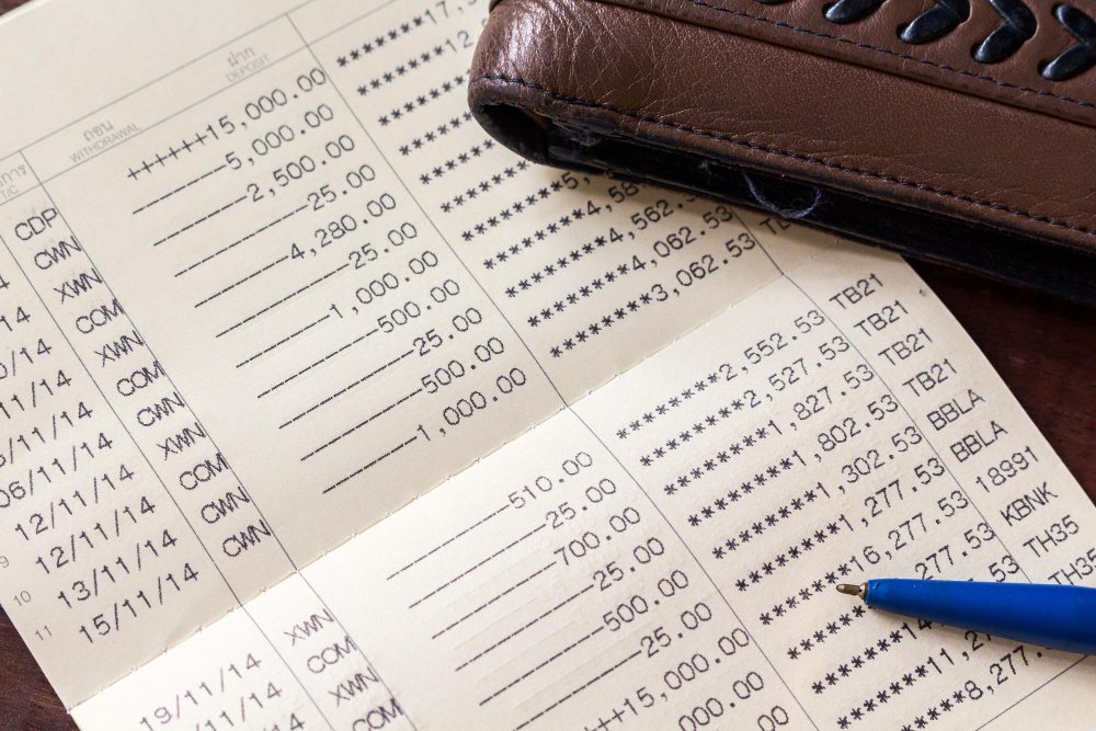 Small business owner reviewing cash transactions