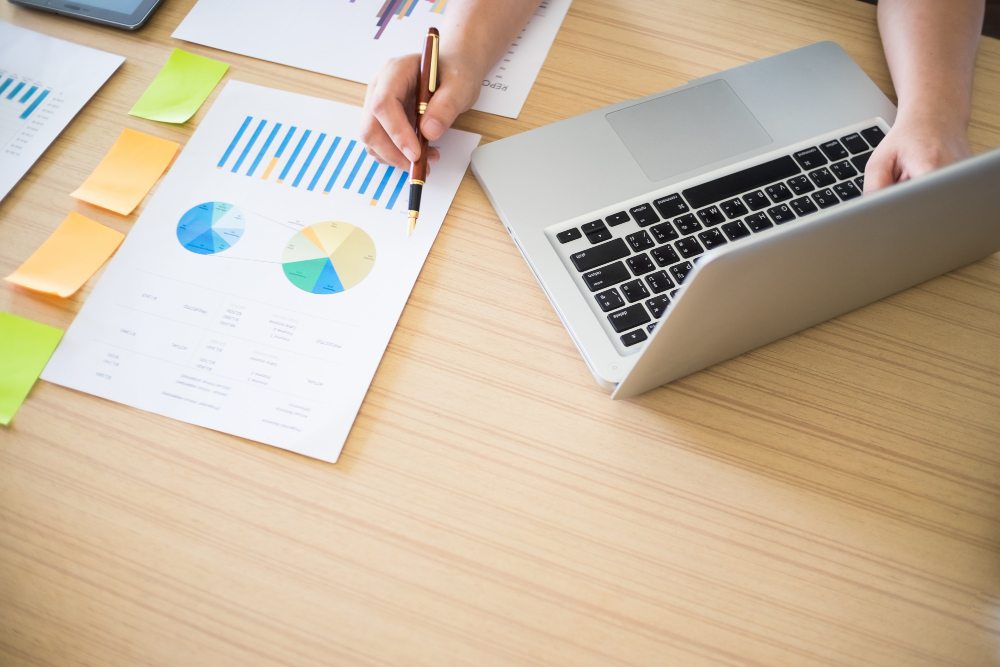 Business accounting workspace with laptop and financial documents