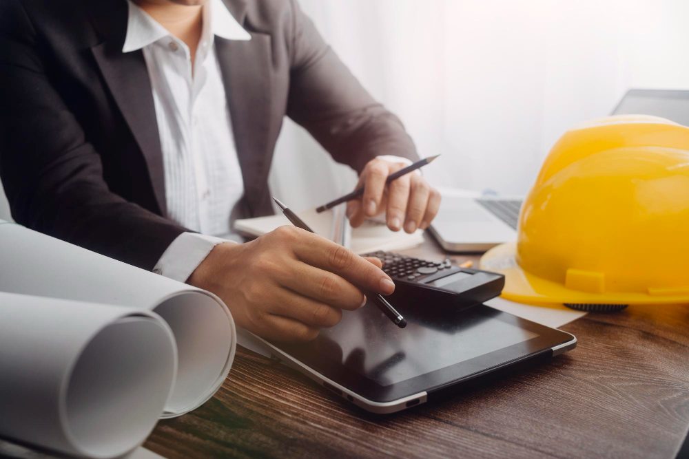 Construction professionals reviewing financial data