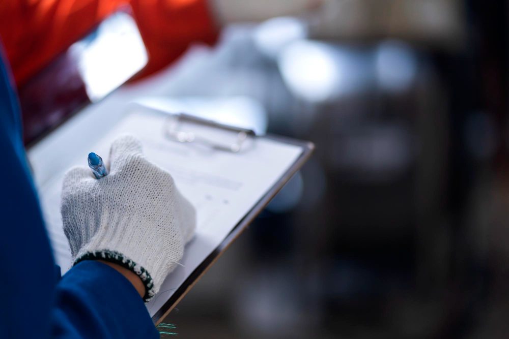 Engineer inspecting industrial equipment during maintenance