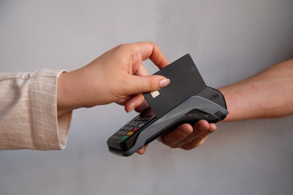 Customer paying with NFC card at a retail checkout terminal