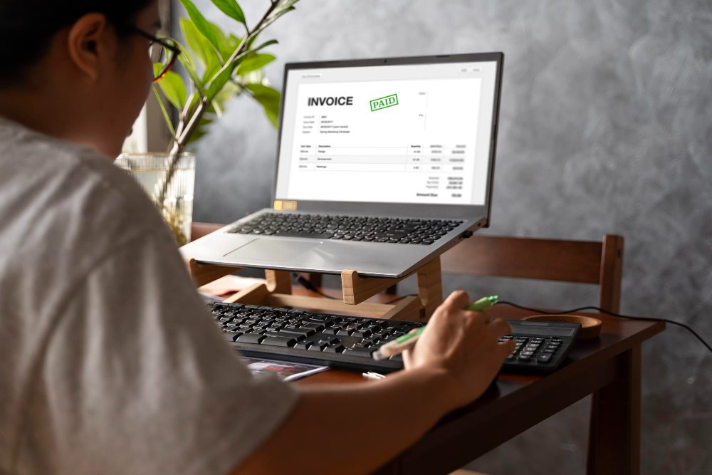 Accountant using digital e-invoice software in office