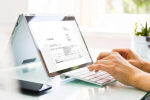 Business advisor reviewing financial reports at desk