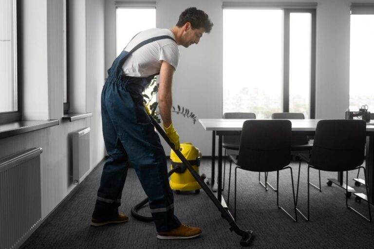 Professional cleaner disinfecting office interior space