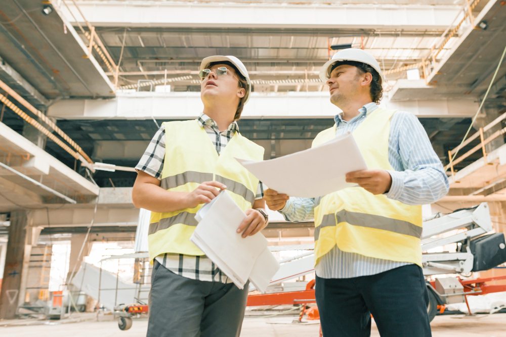 Construction inspector examining active job site