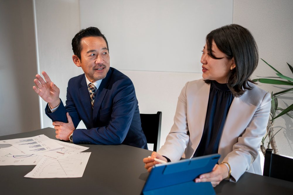 Contractor meeting with advisor to review insurance policy