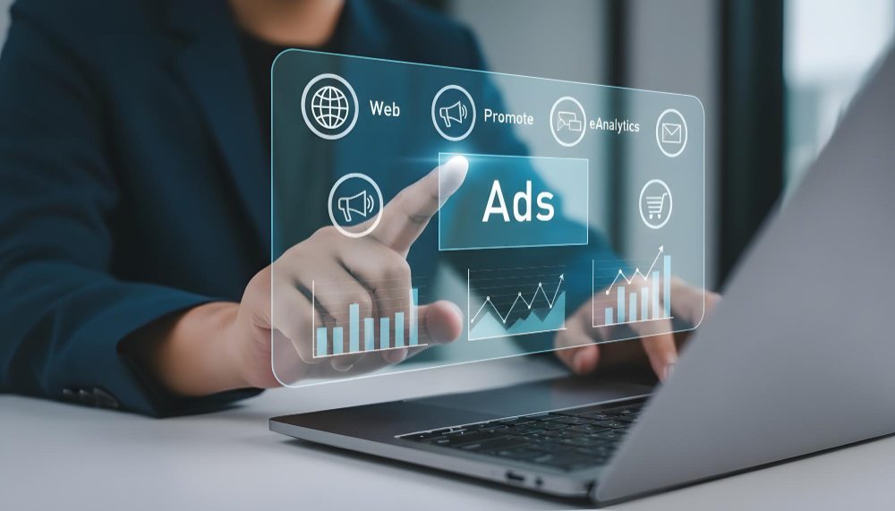 Business professional analyzing digital advertising metrics on laptop