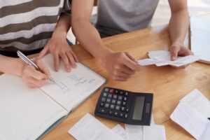 Professional reviewing financial records and calculating fees