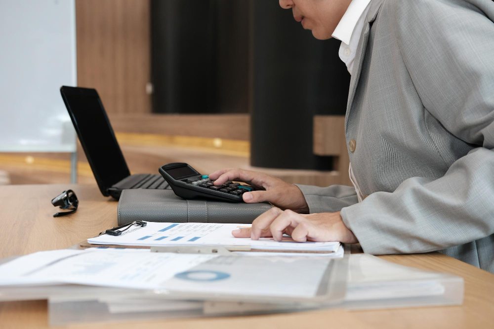 Businessman organizing invoices and financial paperwork