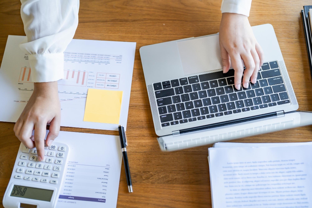 Calculating taxes with financial documents and calculator