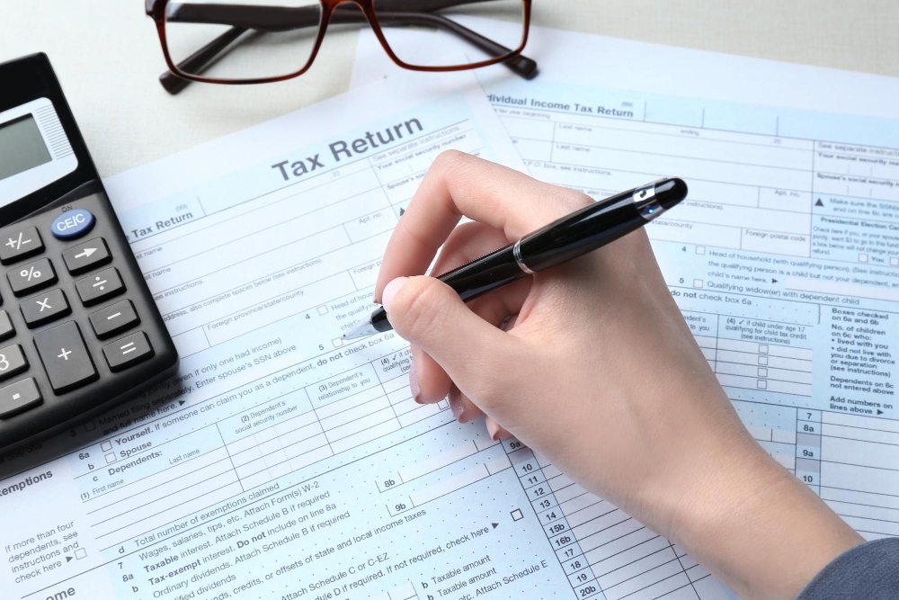 Woman filling out individual income tax form