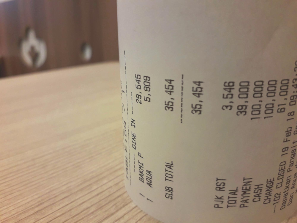 Detalle de un recibo impreso con los datos de la transacción