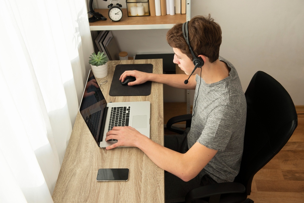 Person using computer at home representing remote work or digital tracking