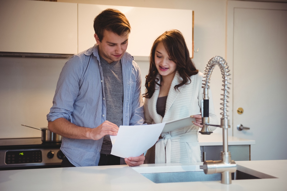homeowners checking invoice after work is completed