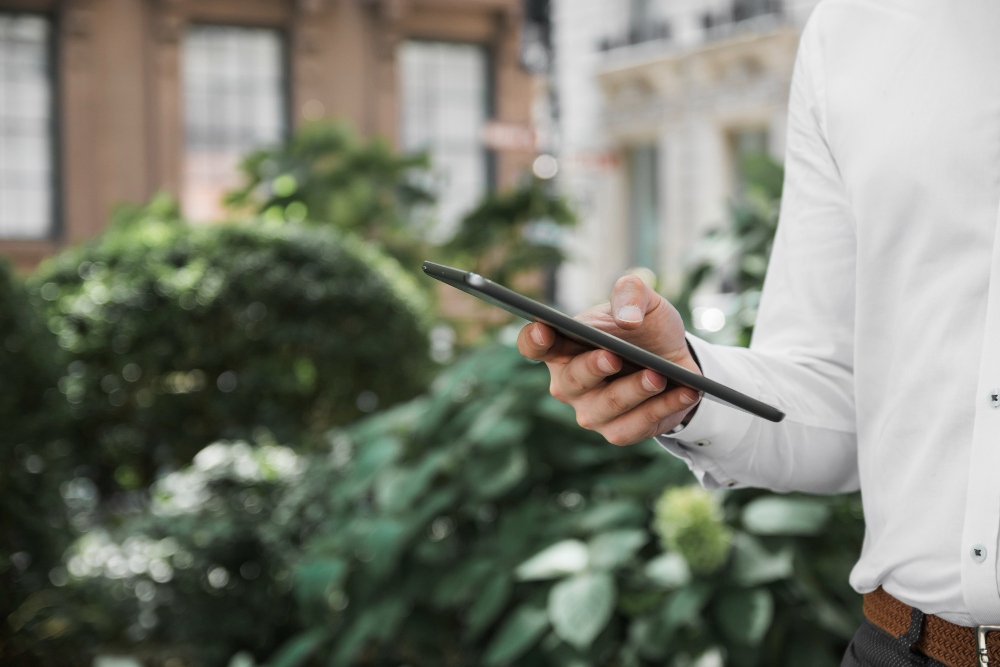 landscaper checking project details on mobile app