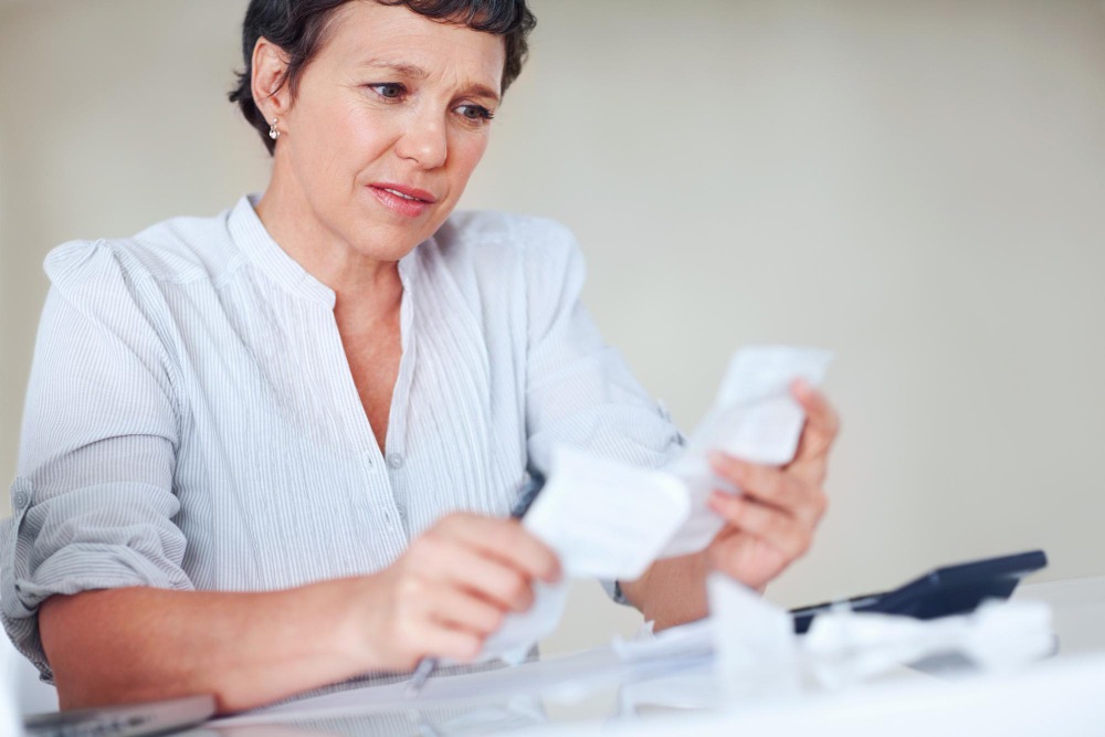 office worker completing an acknowledgement receipt for payment