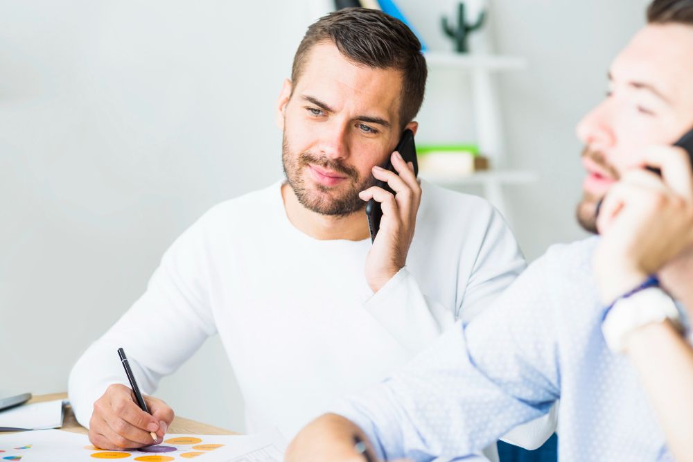 cleaning business owner on phone doing sales consultation with new client