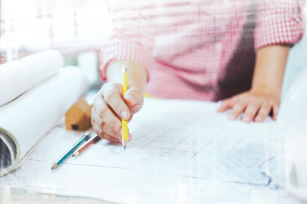 Architects and engineers reviewing construction project plans