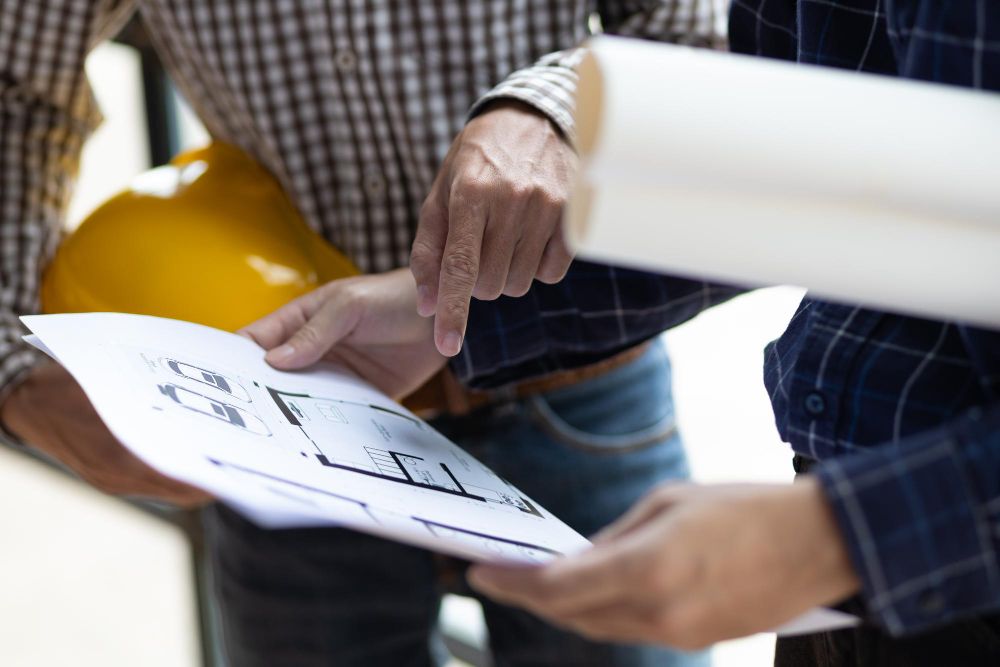 client reviewing construction sales proposal with contractor